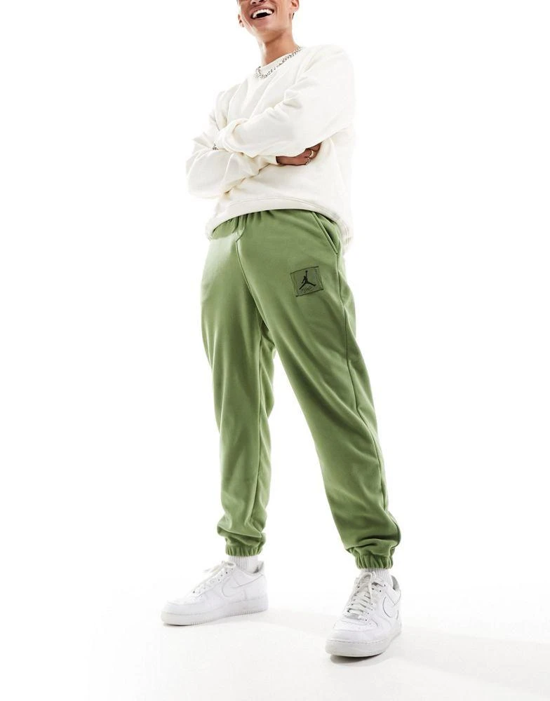 Shop Jordan winterized fleece jogger in olive green on Sale at