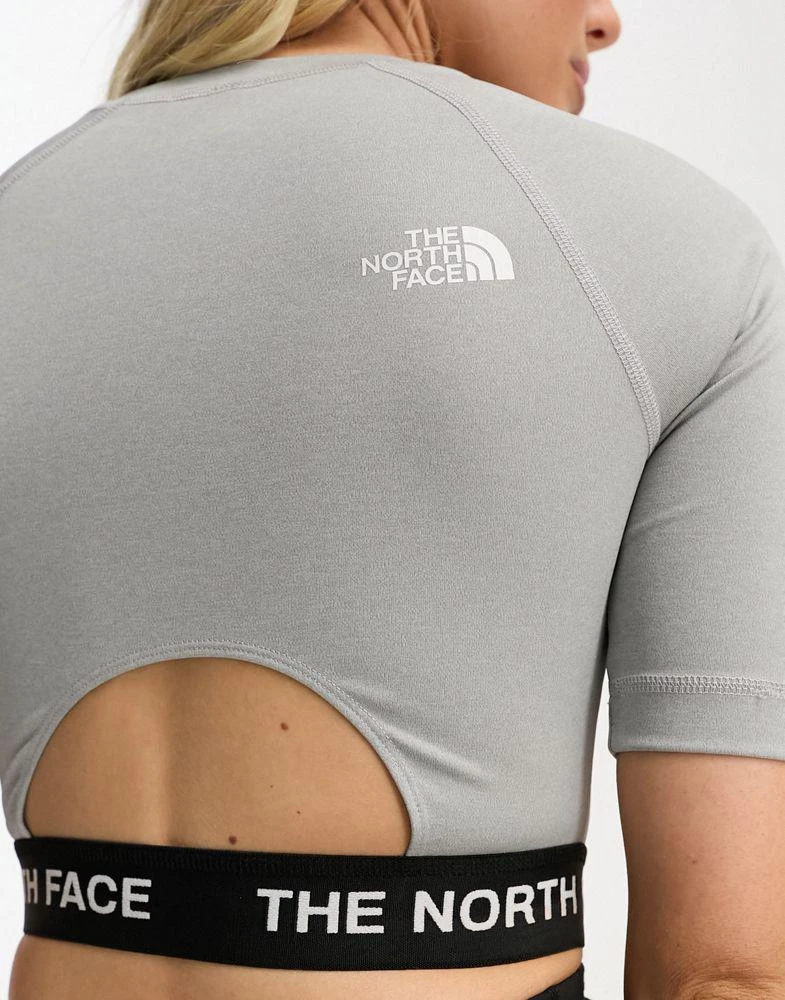 The North Face The North Face Training cropped long sleeve performance top in grey 2