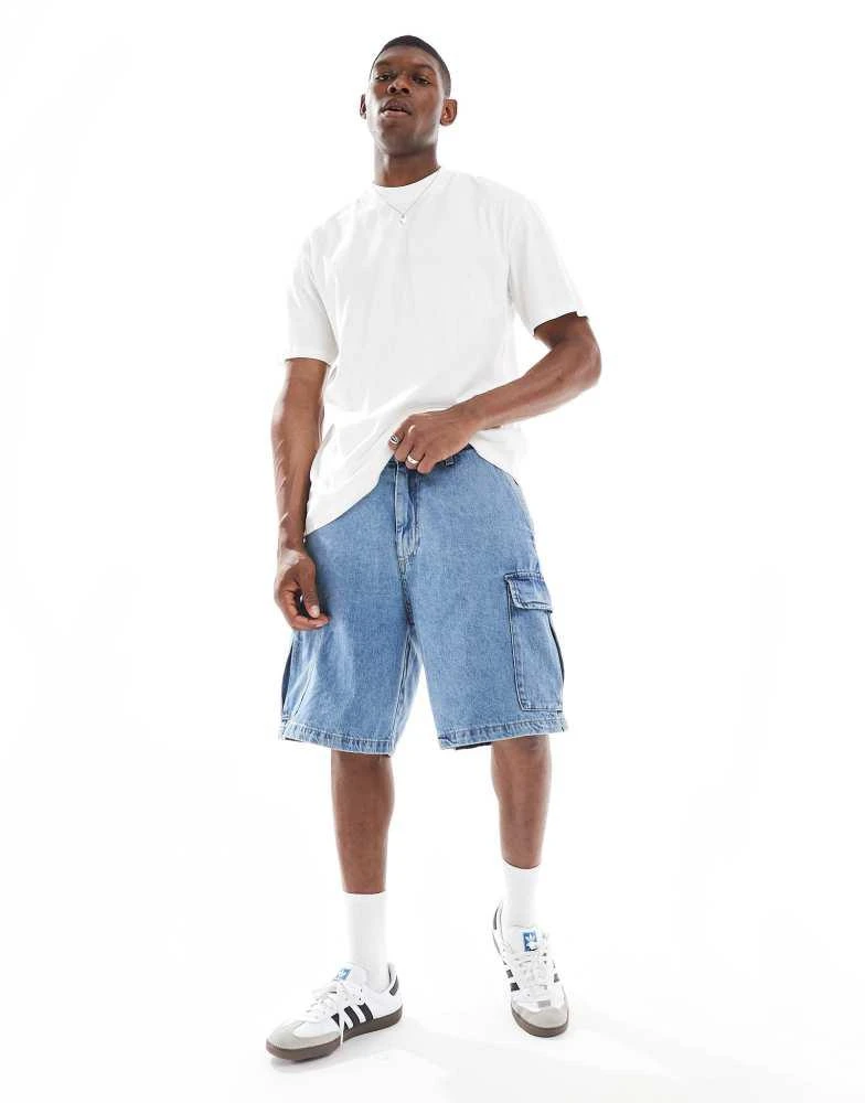 Shop Jack Jones baggy cargo denim short in light blue wash on
