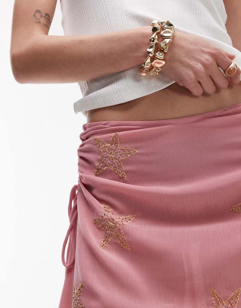 Shop Topshop mini skirt with star beading in pink on Sale at