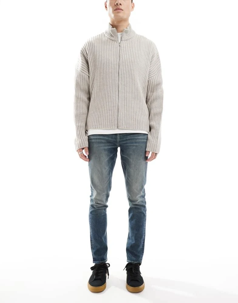 ASOS ASOS DESIGN skinny jeans with green tint in light wash blue 1