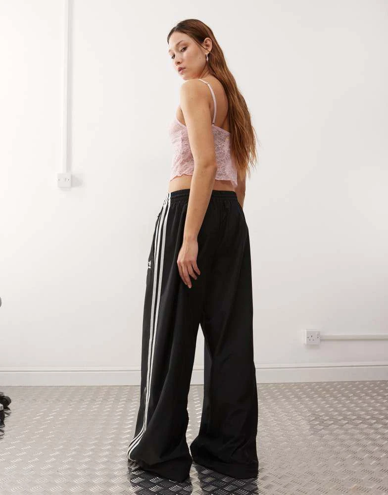 Adidas adidas Originals Adicolor wide leg track pants in black 4