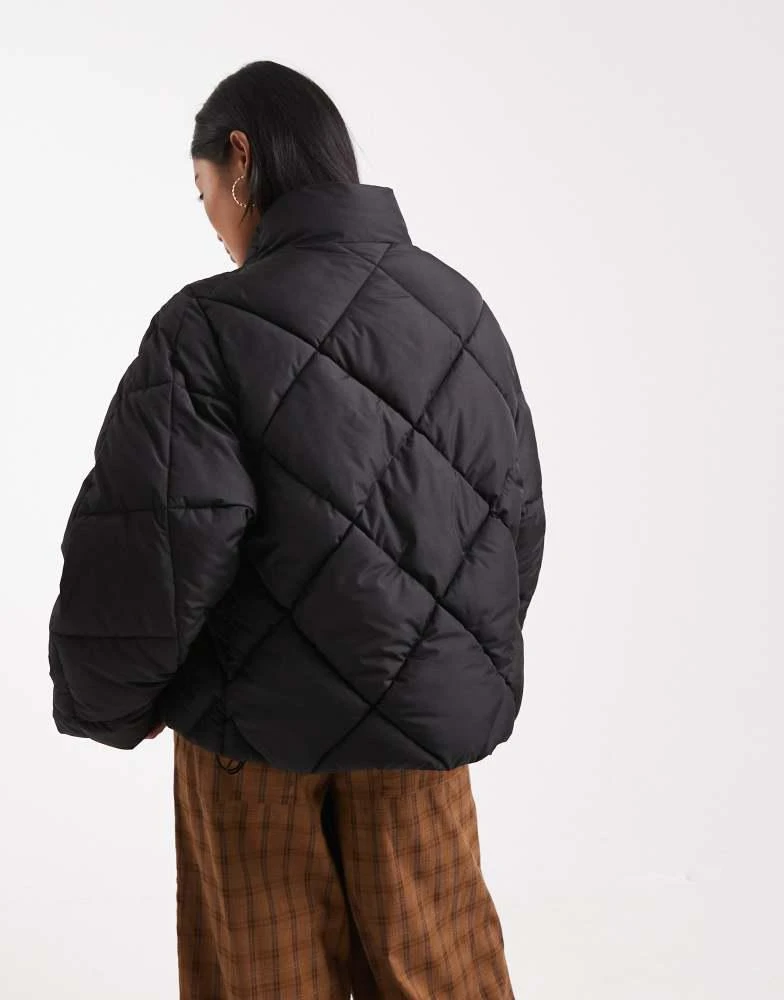 Shop Miss Selfridge Petite oversized quilted funnel neck crop