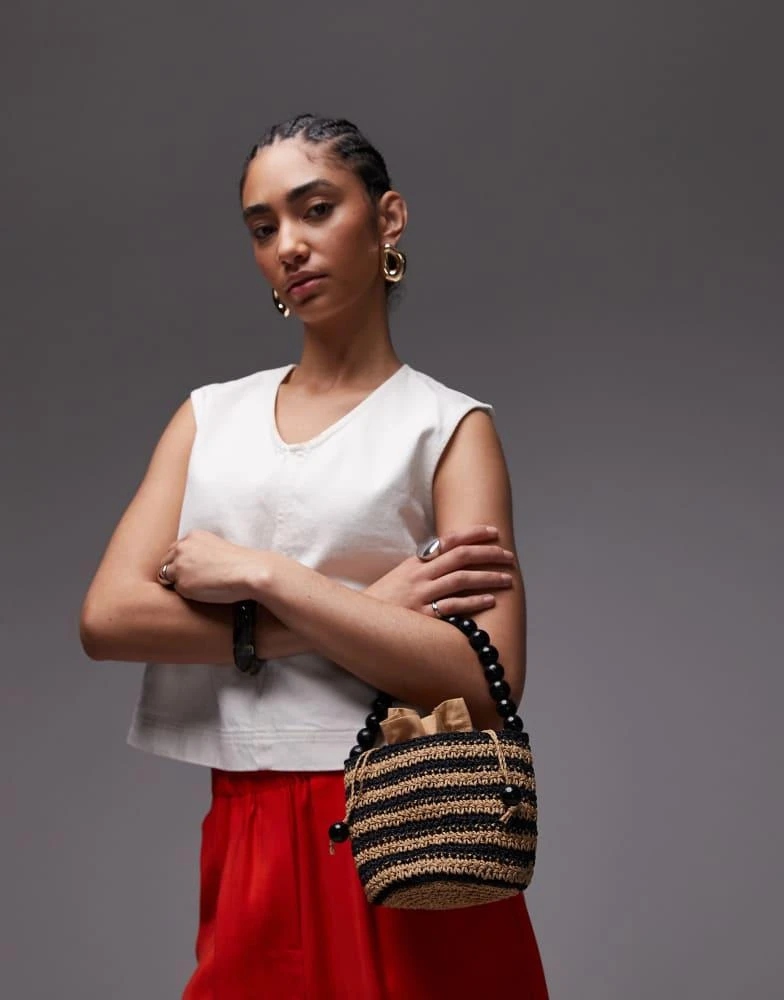 Shop Topshop Gevvie beaded handle straw bag in black stripe on