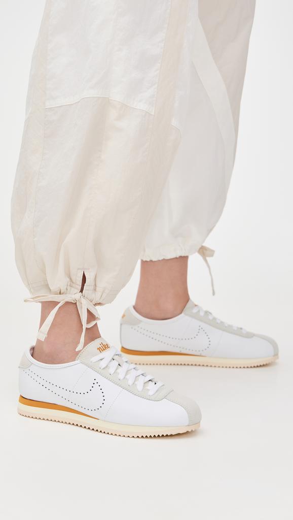 all white nike cortez on feet