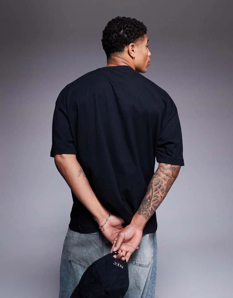ASOS ASOS DESIGN oversized striped t-shirt with sports graphic in black 3