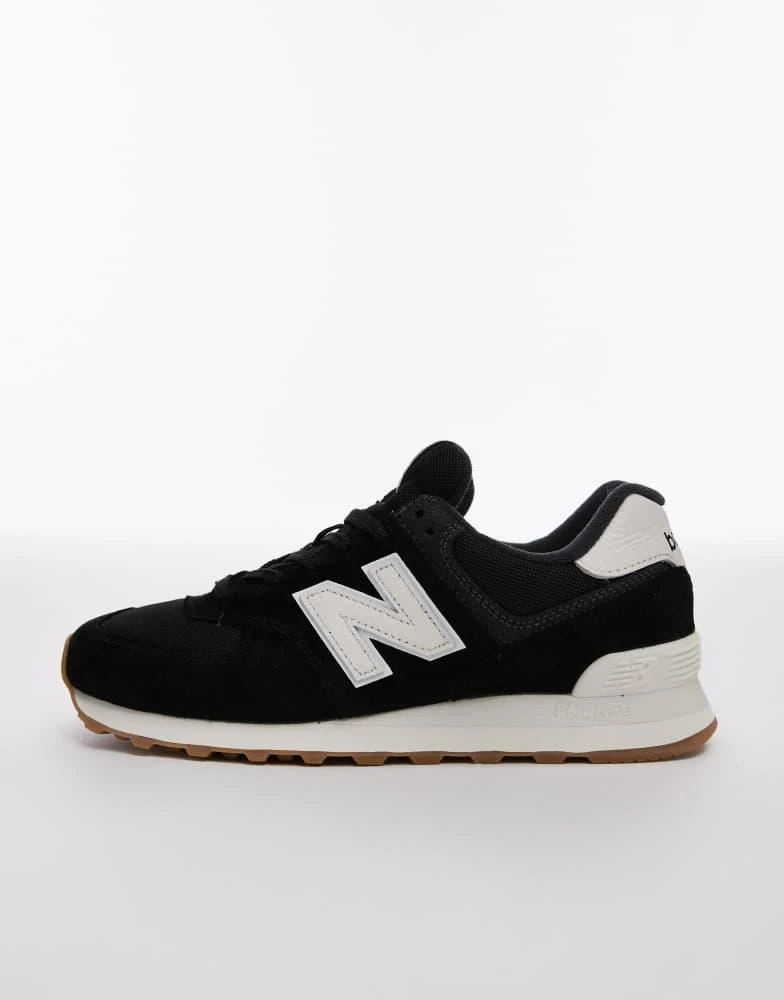 New Balance 574 trainers in black and white – On Sale Now with Up