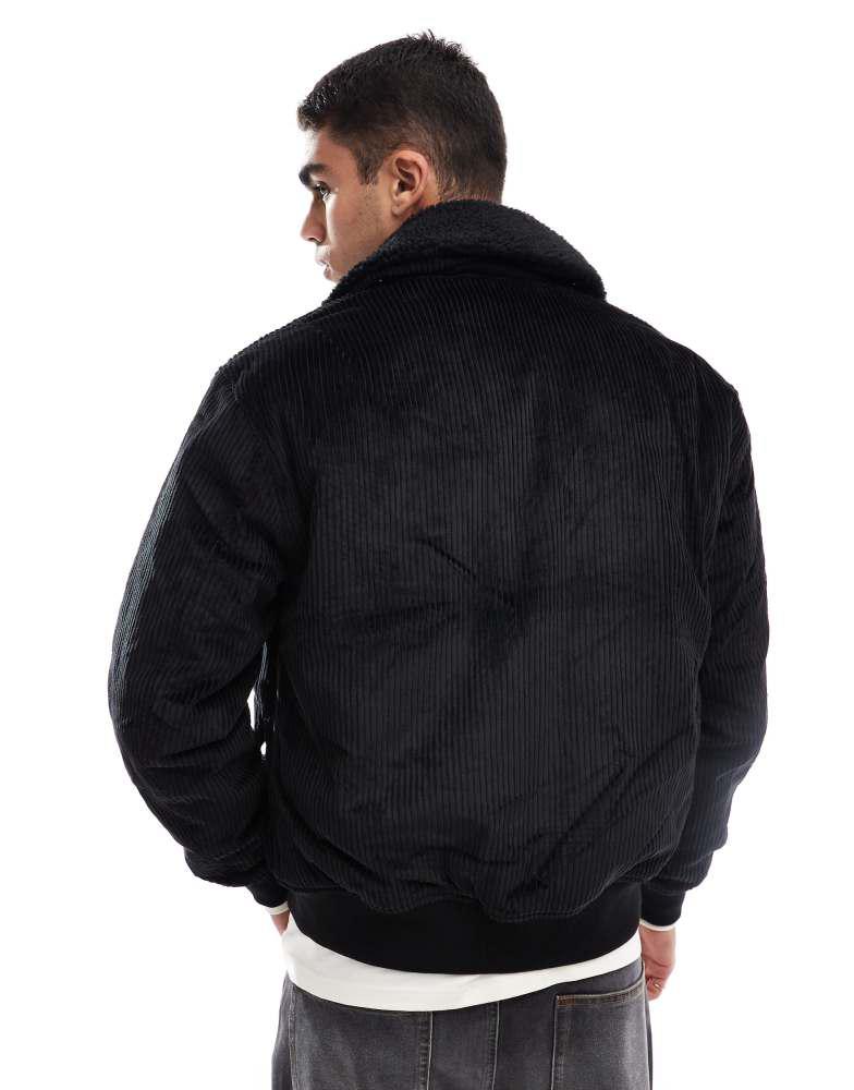 Shop Fred Perry cord bomber jacket in black with removable borg