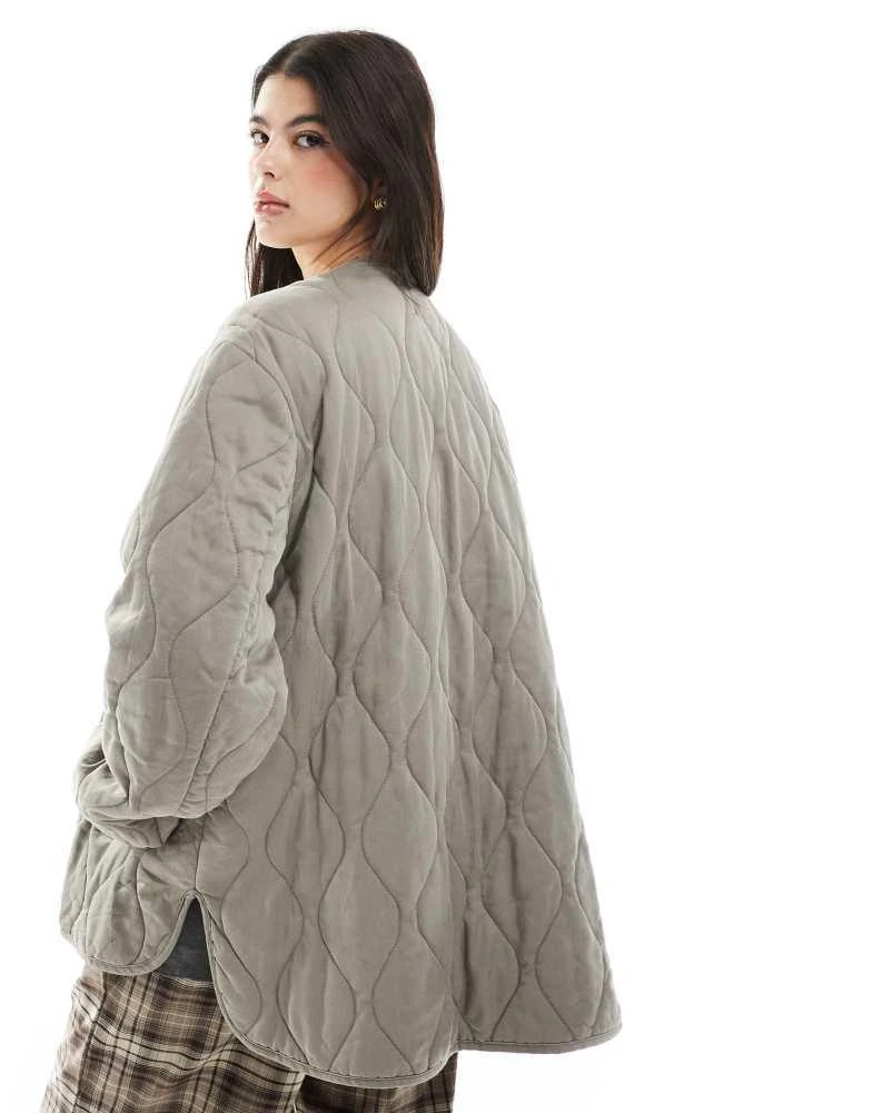 ASOS ASOS DESIGN dolphin hem collarless quilted jacket in khaki 4