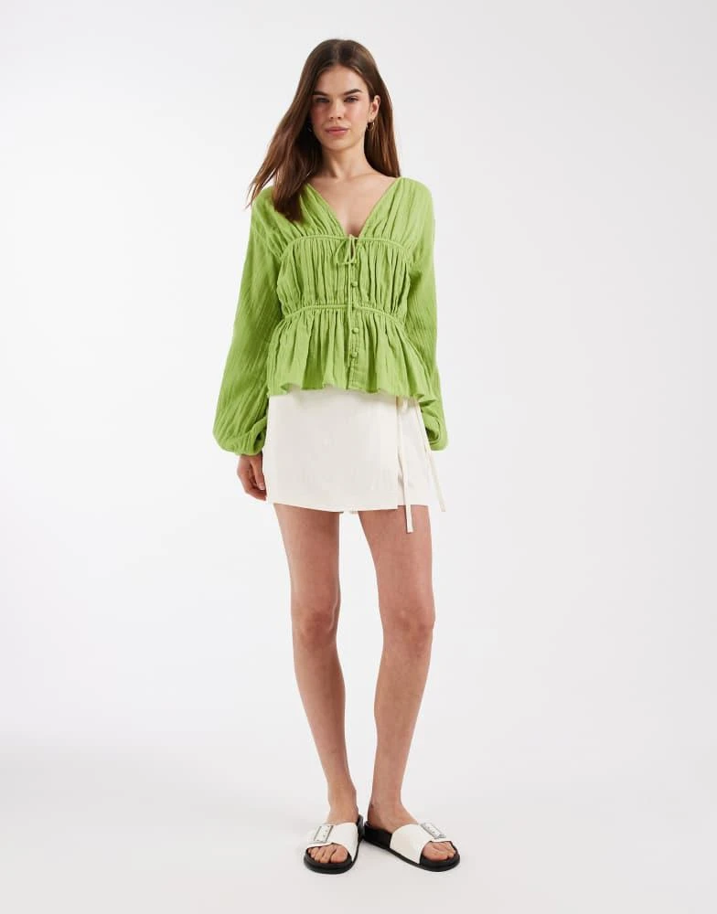 ASOS ASOS DESIGN long sleeve smock top with button front in green 2