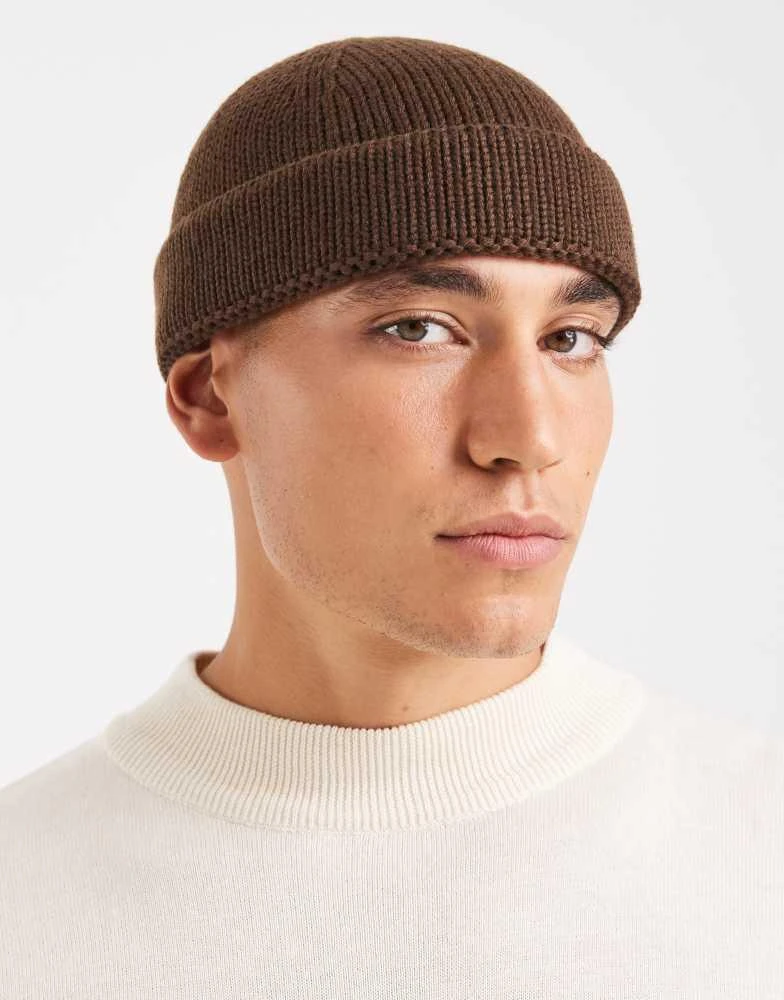 Shop ASOS DESIGN knitted rib mini fisherman beanie in chocolate