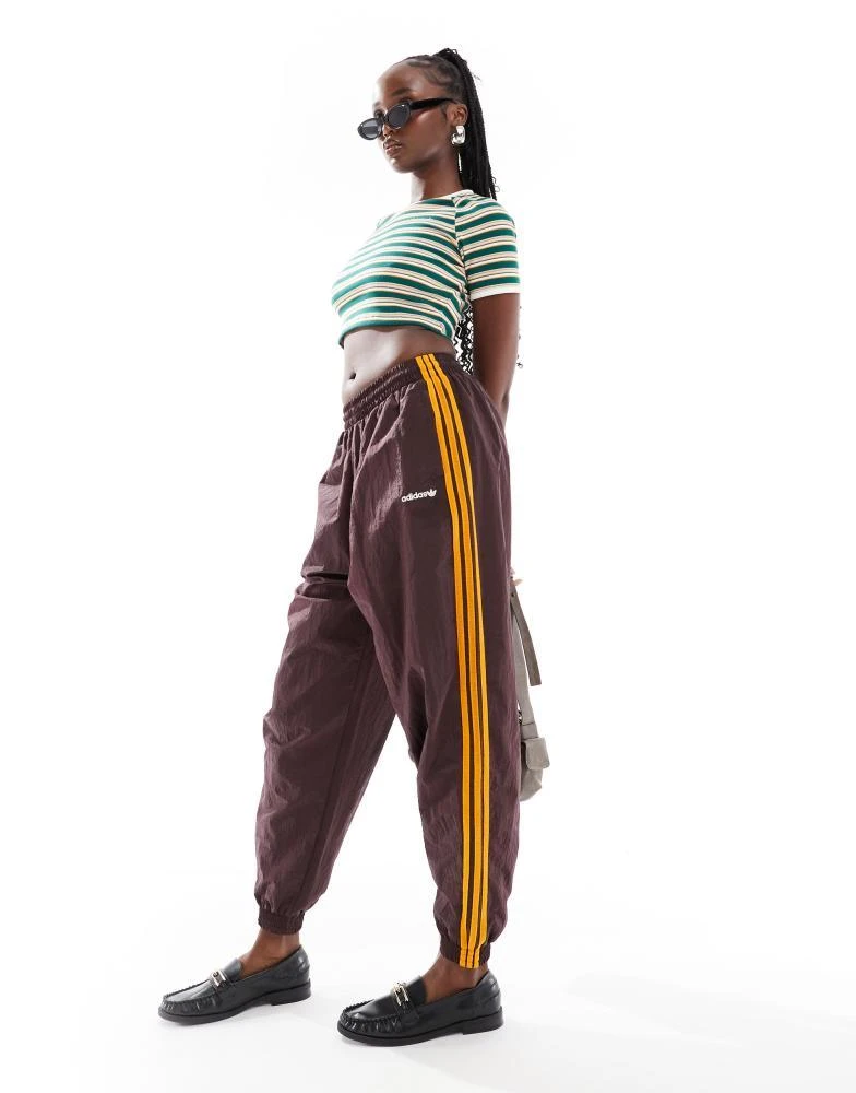 Adidas adidas Originals 80s track pant in shadow brown 1