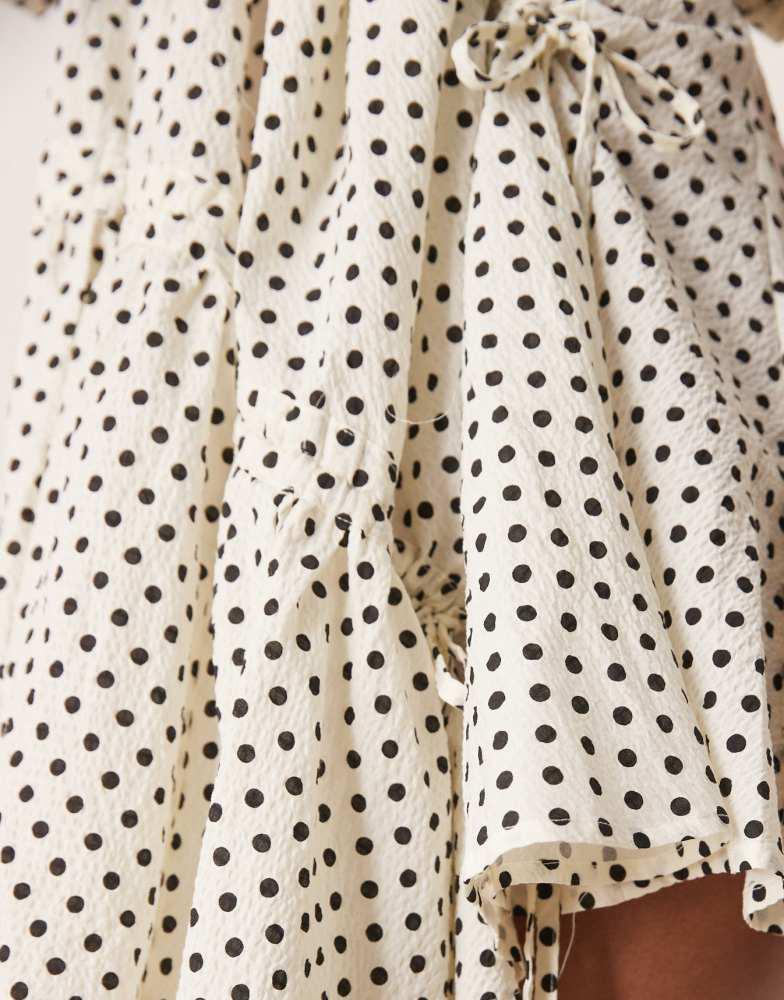 Ghospell Ghospell ruched asymmetric polka dot mini dress in pearl ivory