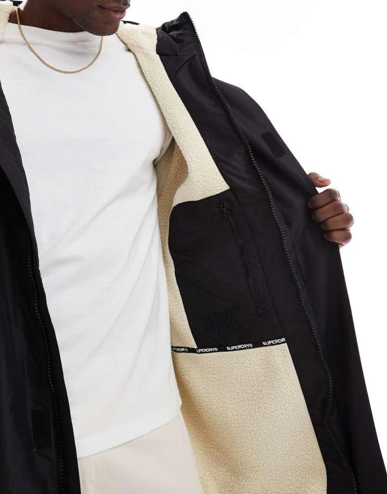 Superdry Superdry waterproof changing robe in black and white 4