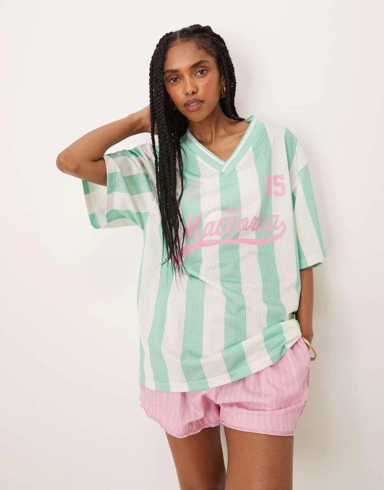 ASOS ASOS DESIGN oversized v neck football t-shirt with mallorca graphic in green stripe 1