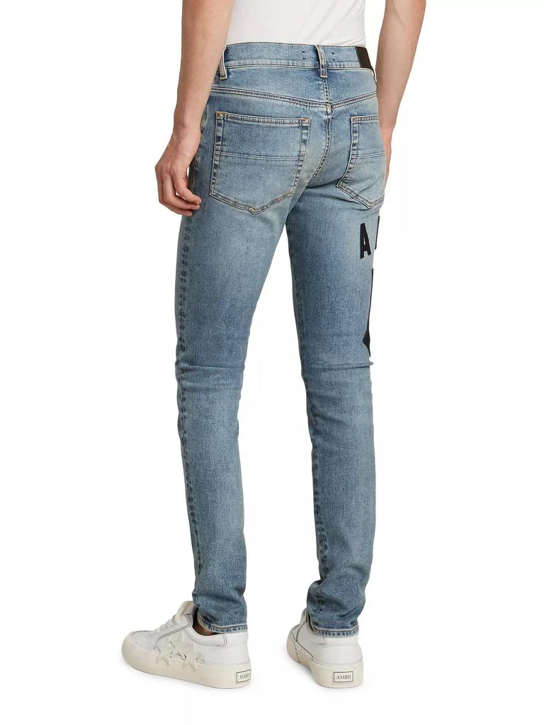 AMIRI Suede Appliqué Logo Skinny Jeans 5