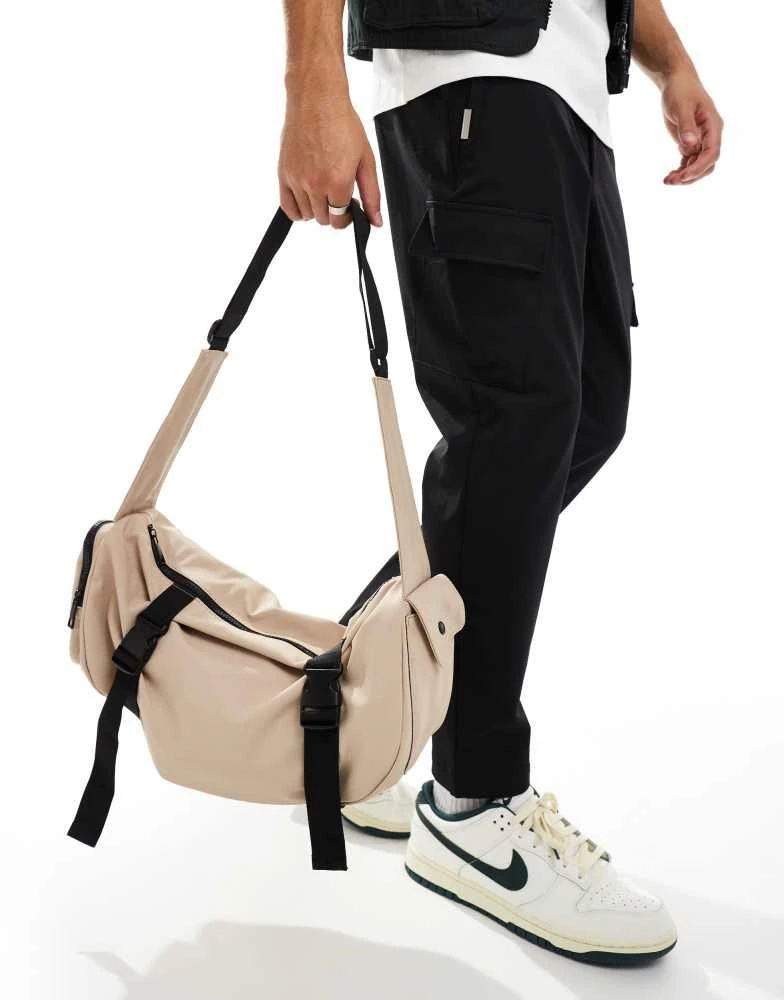 ASOS ASOS DESIGN rubberised cross body bag with pocket and buckle detail in beige 2