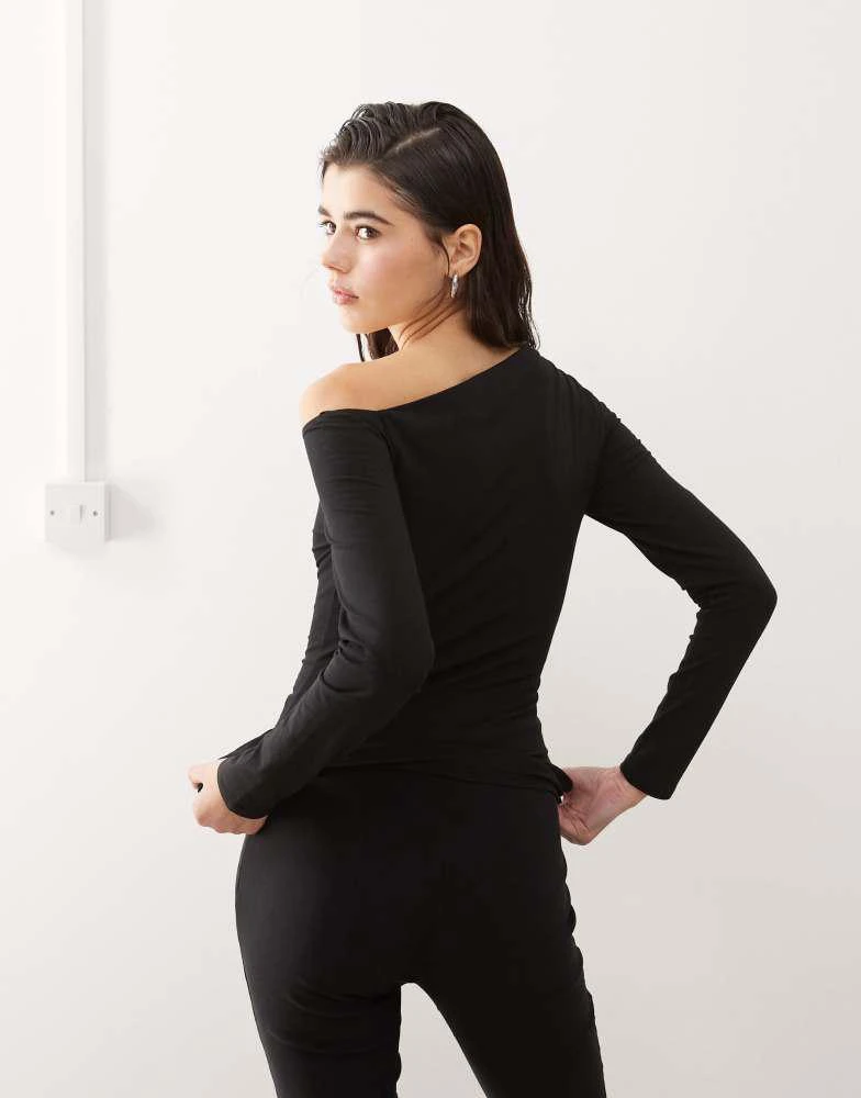 Monki Monki asymmetric shoulder long sleeve top with eyelet detail in black 4