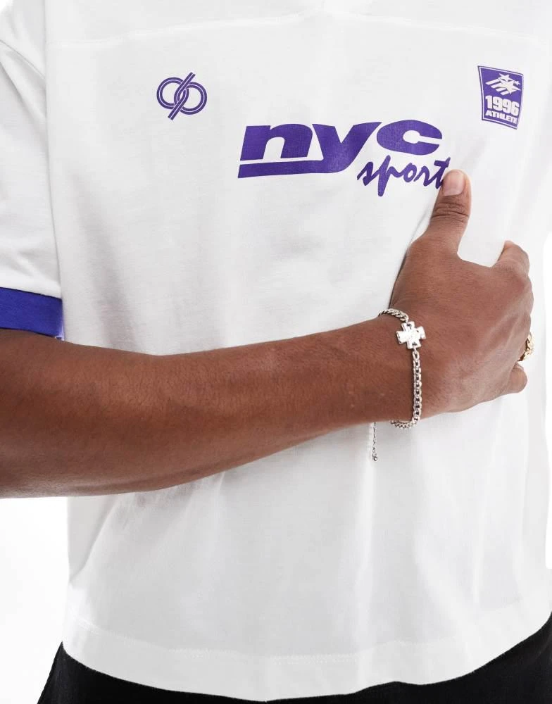 ASOS ASOS DESIGN boxy oversized polo with cut and sew and sports graphics in white 4