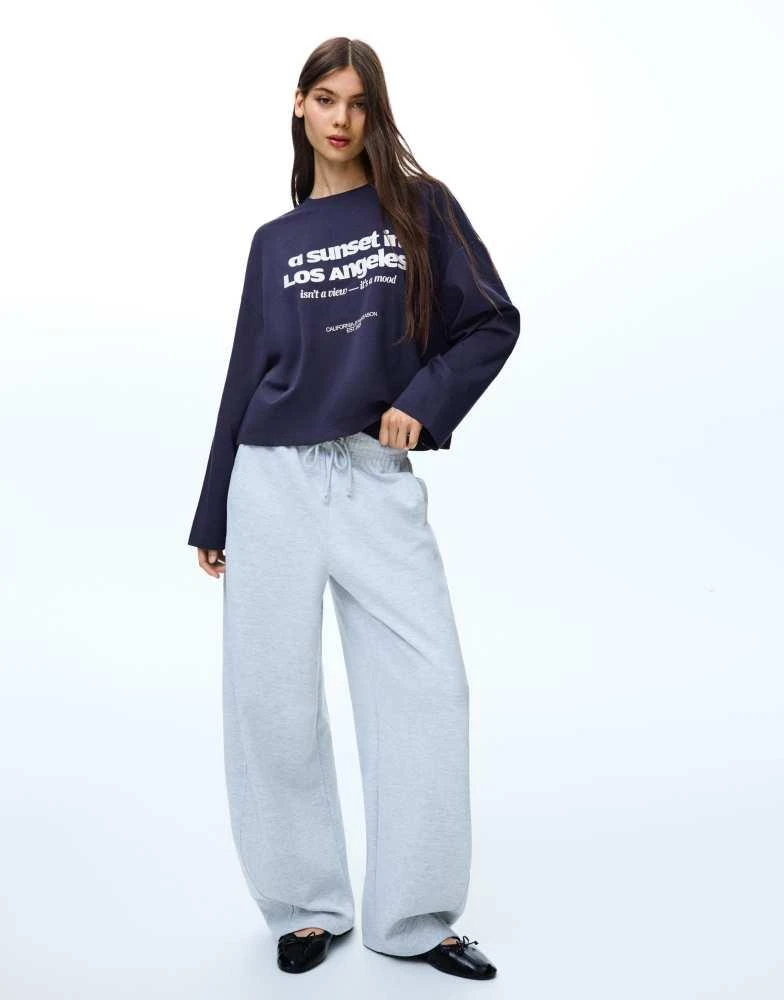 Bershka Bershka Long sleeve boxy t-shirt with print in navy from ASOS