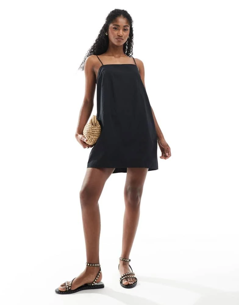 Shop Monki cotton poplin mini dress with tie straps in black on - Main Image