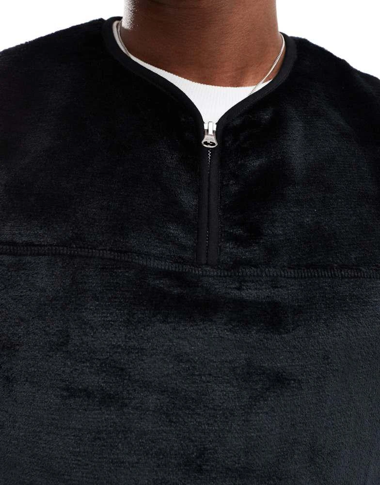ASOS ASOS DESIGN oversized quarter zip faux fur vest in black 2