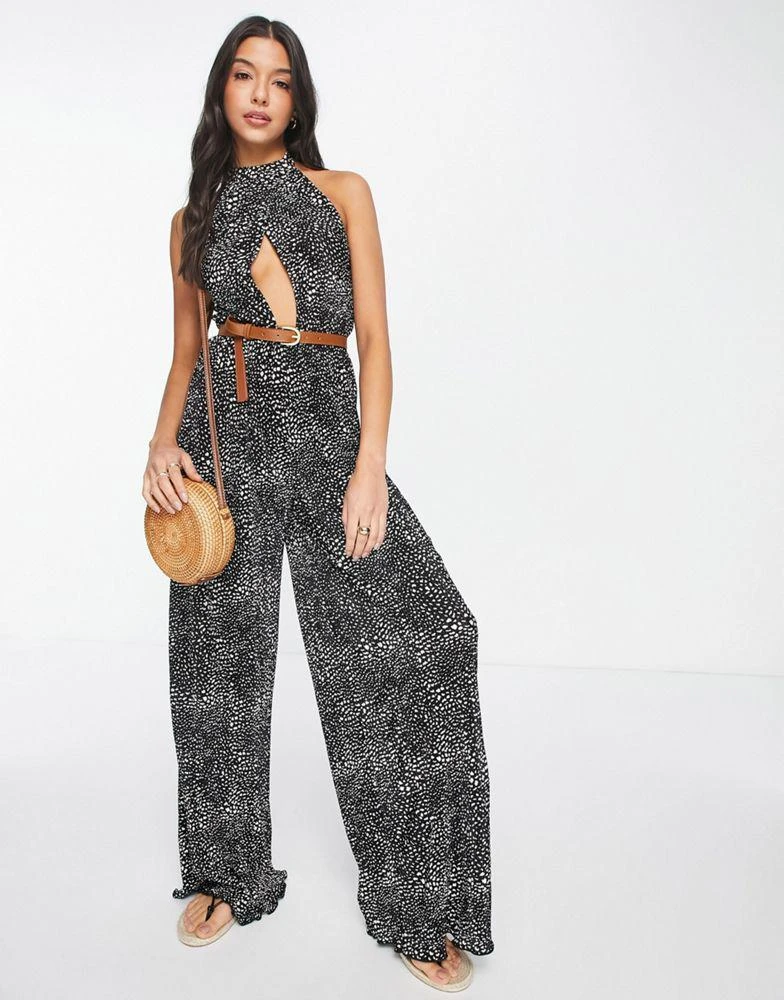 ASOS ASOS DESIGN plisse halter cut out jumpsuit with belt in spot print 1