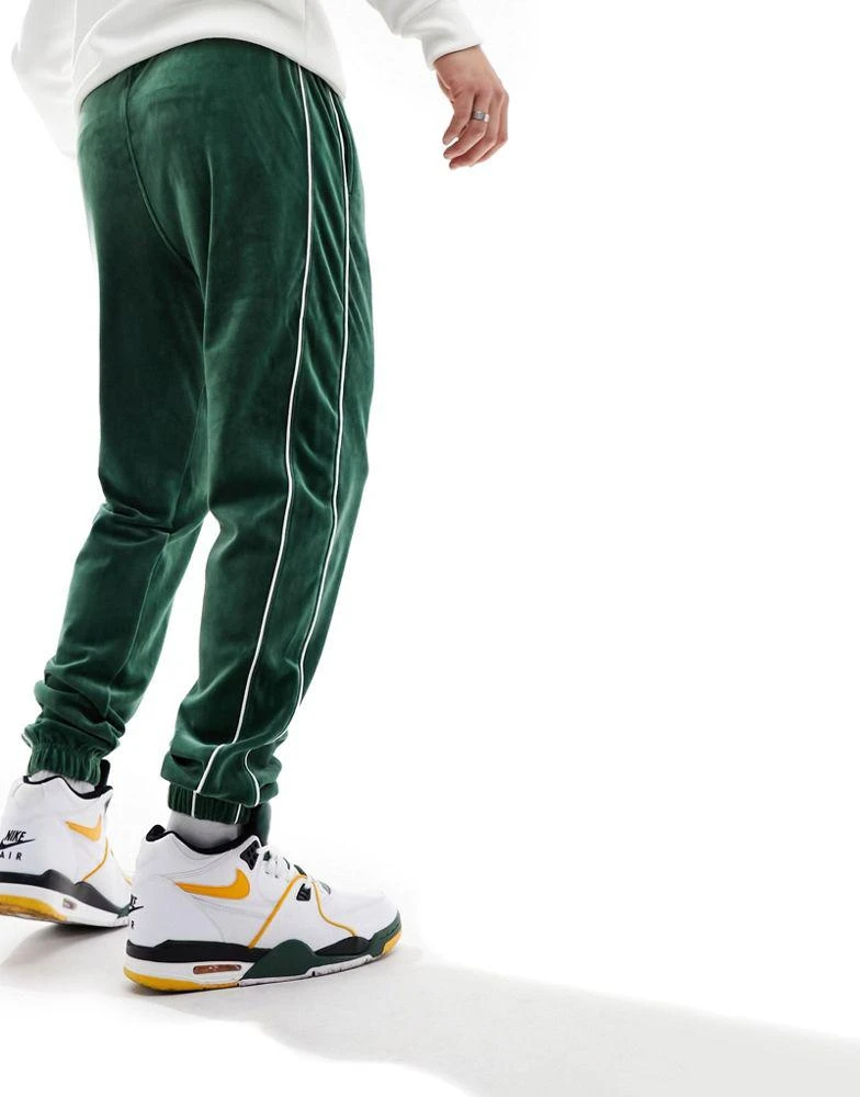 NIKE Nike Club velour joggers in green 3