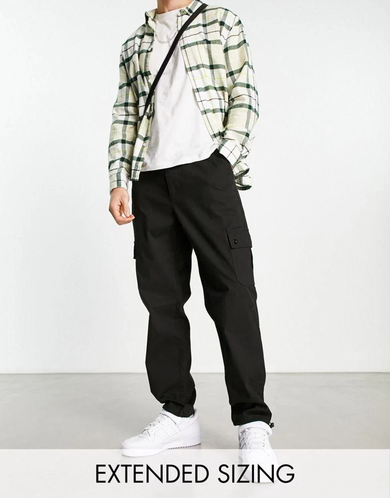 ASOS ASOS DESIGN tapered cargo trousers with toggles in black 1