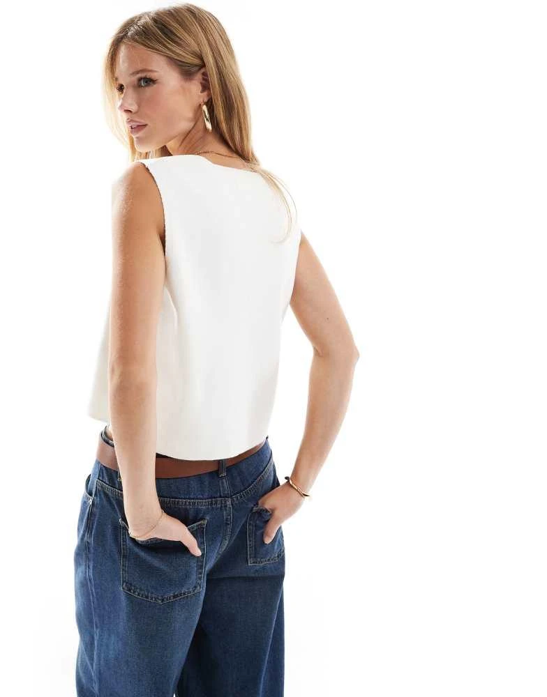 ASOS ASOS DESIGN knitted compact v neck waistcoat in white 2