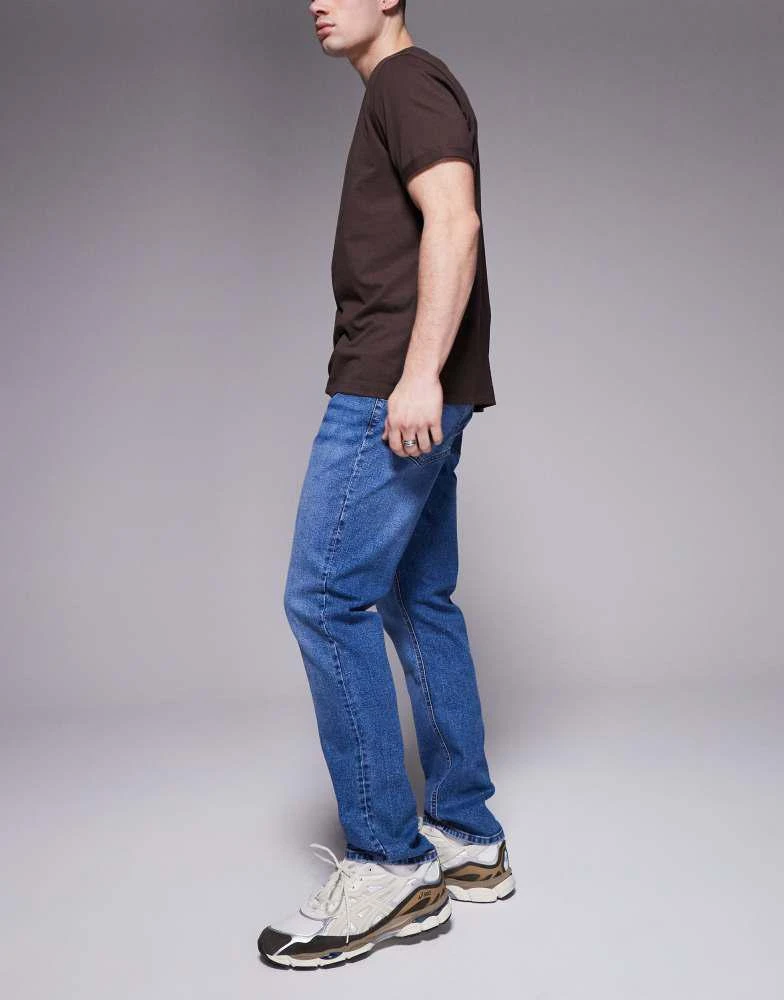 ASOS ASOS DESIGN slim fit jean in mid wash blue 3