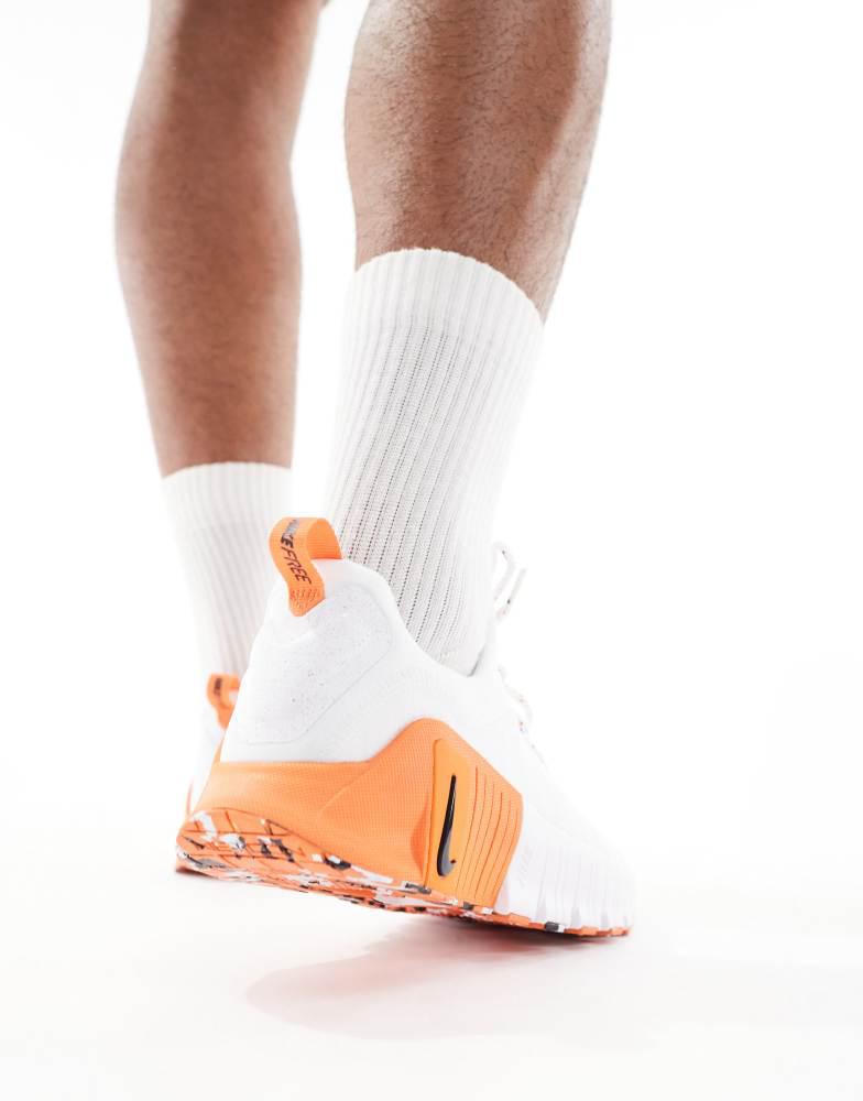 nike training metcon trainers in white and orange