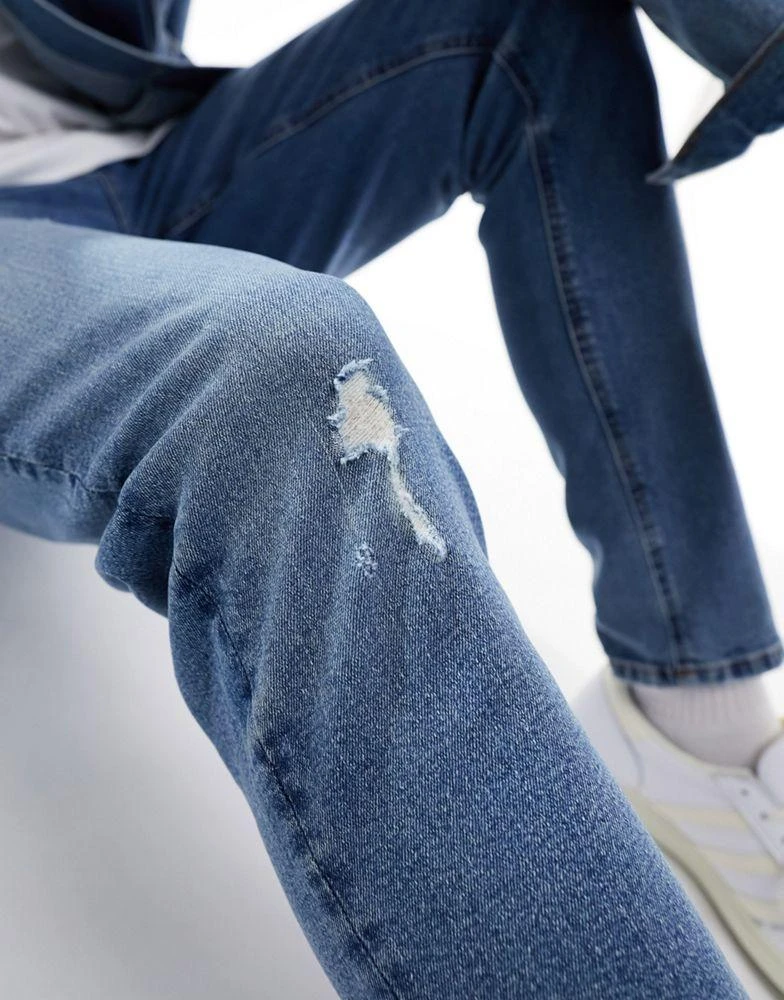 ASOS ASOS DESIGN skinny jeans with knee rip in dark wash blue 2