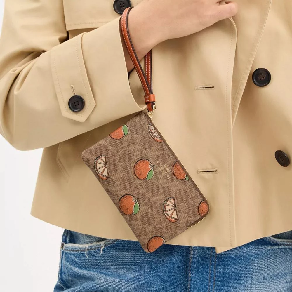Coach Corner Zip Wristlet In Signature Canvas With Orange Print 5