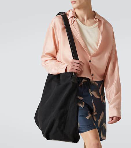 Shop Leather-trimmed canvas shoulder bag on Sale at BeyondStyle
