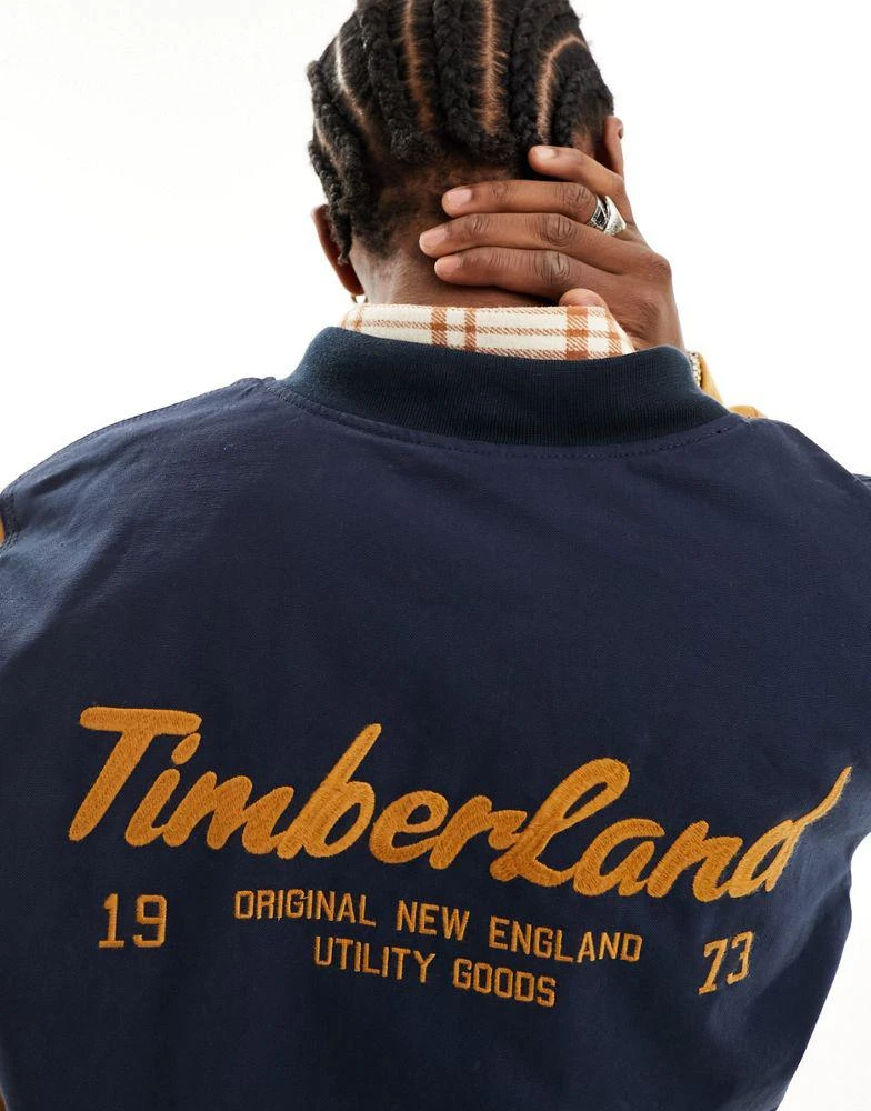 Timberland Timberland utility varsity bomber jacket with back print in navy with contrast sleeves 3