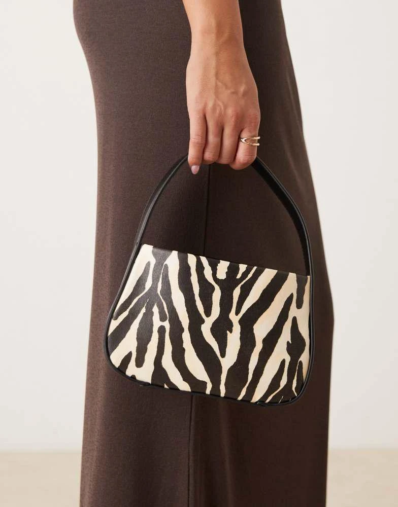 ASOS ASOS DESIGN mini grab clutch bag in zebra print 1