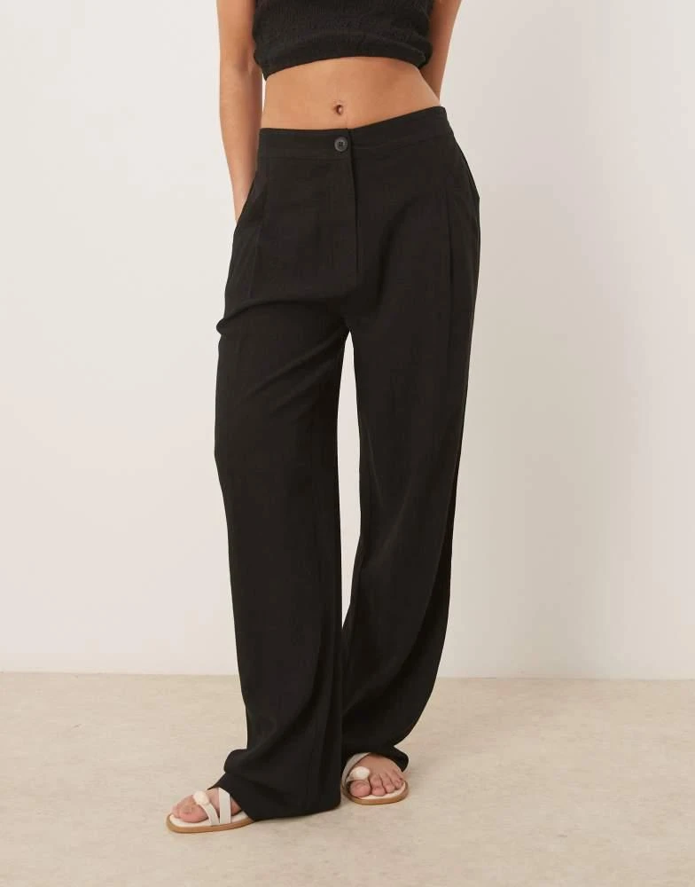 Shop ASOS DESIGN pleat front tapered trousers with linen in black