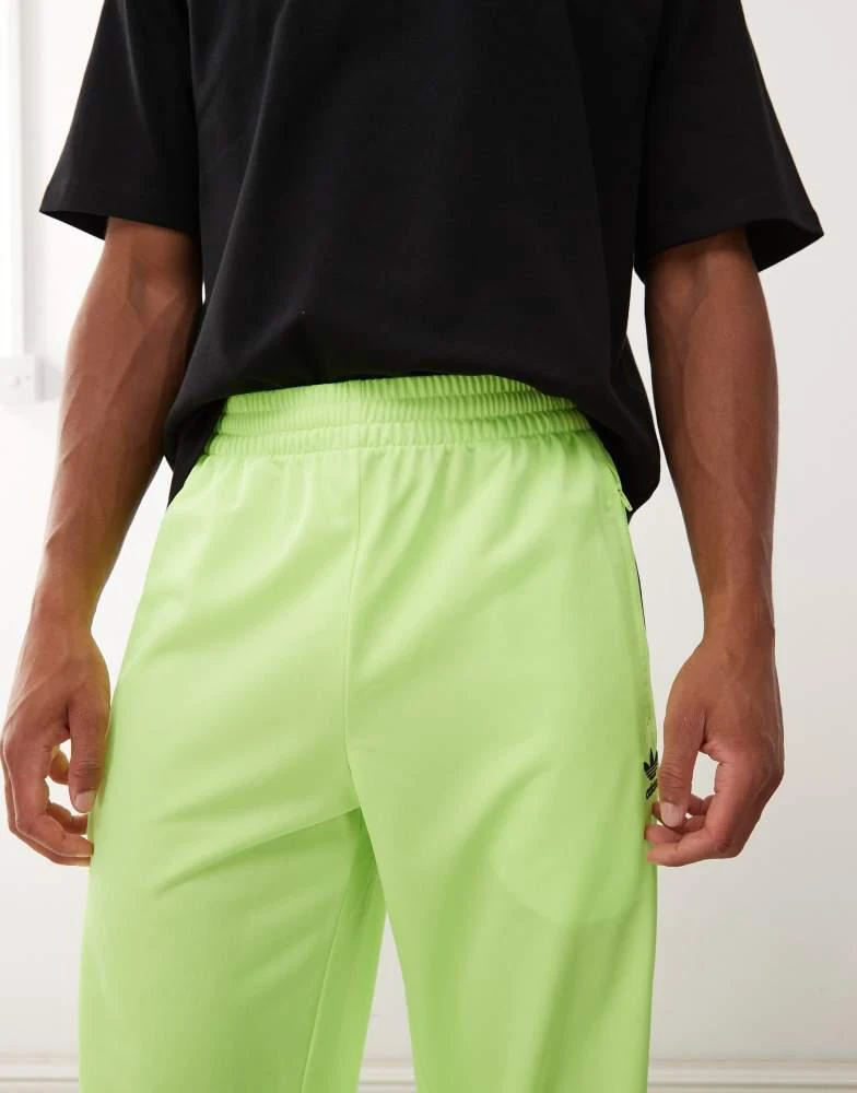 Adidas adidas Originals Firebird track pants in green and black 3