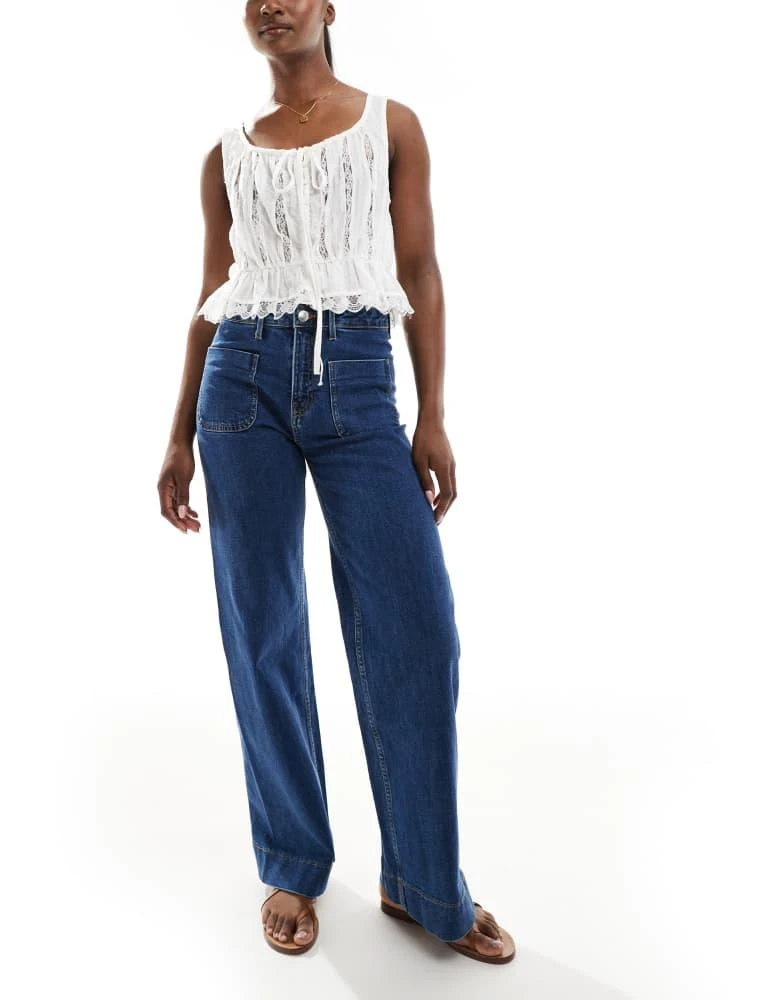 Bershka Bershka high waisted pocket detail jeans in mid wash 1