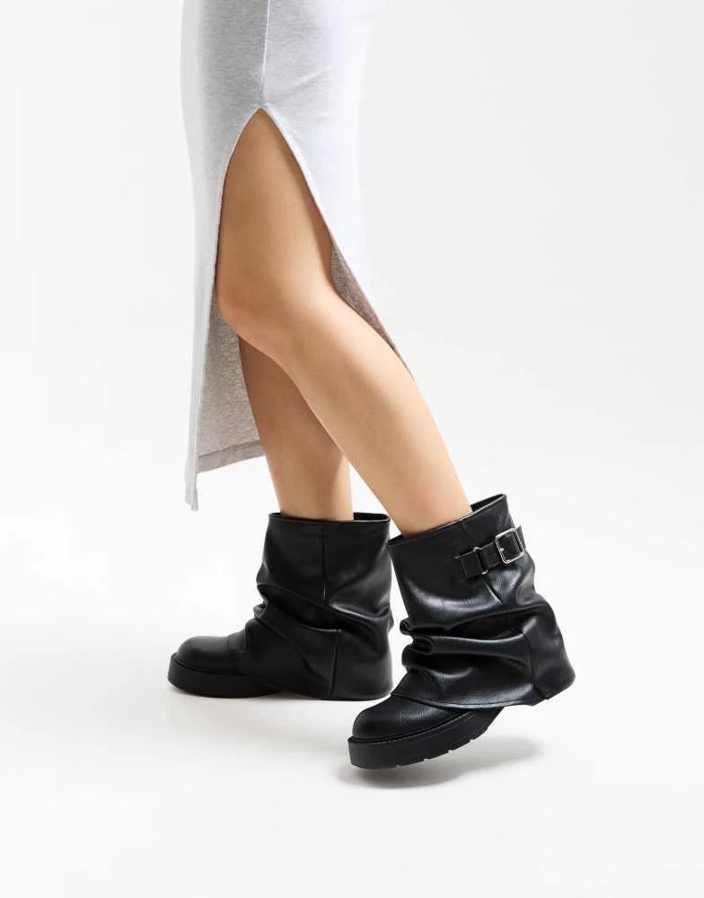 Shop Bershka Flat ankle boots with buckle in black on Sale at