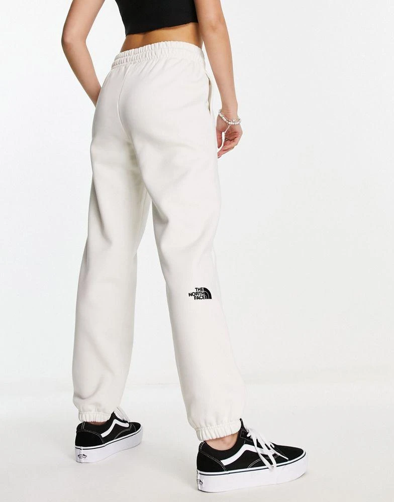 The North Face The North Face Essential oversized joggers in cream Exclusive at ASOS 1