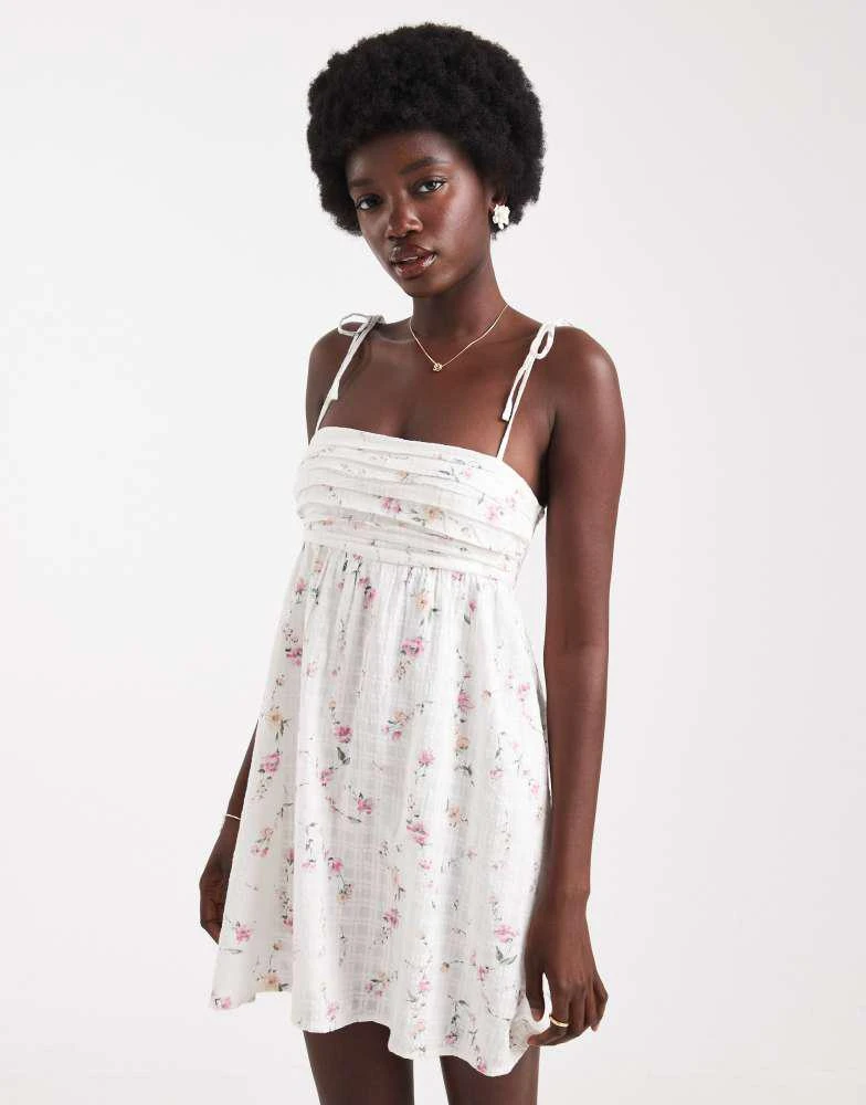 Hollister tie straps babydoll mini dress in White floral