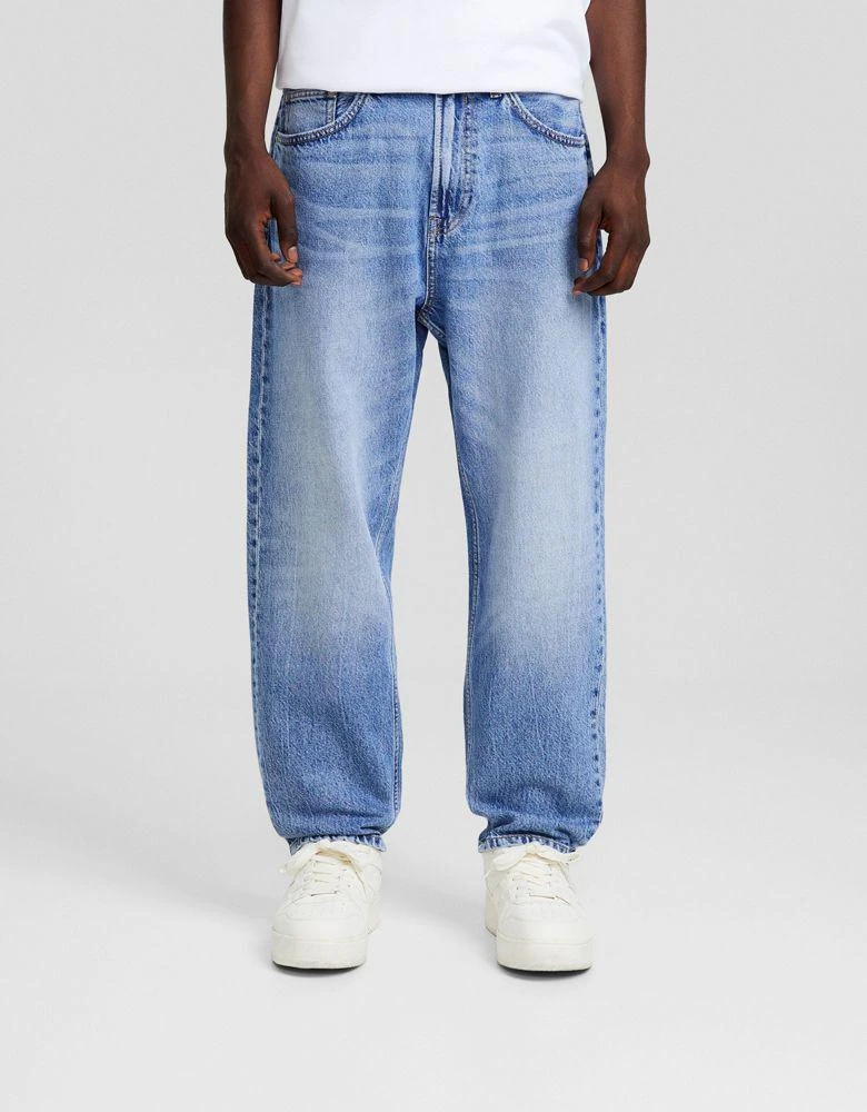 Bershka Bershka loose fit jeans in mid washed blue 1