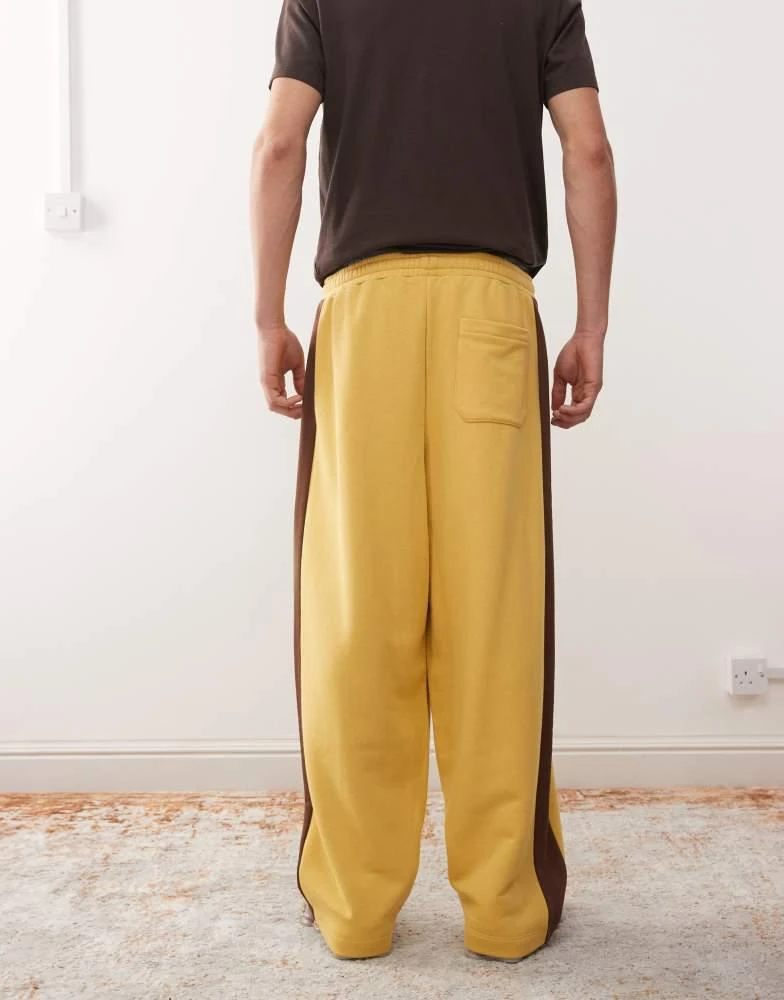 Reclaimed Vintage Reclaimed Vintage heavyweight wide leg jogger in mustard with brown side stripe 4