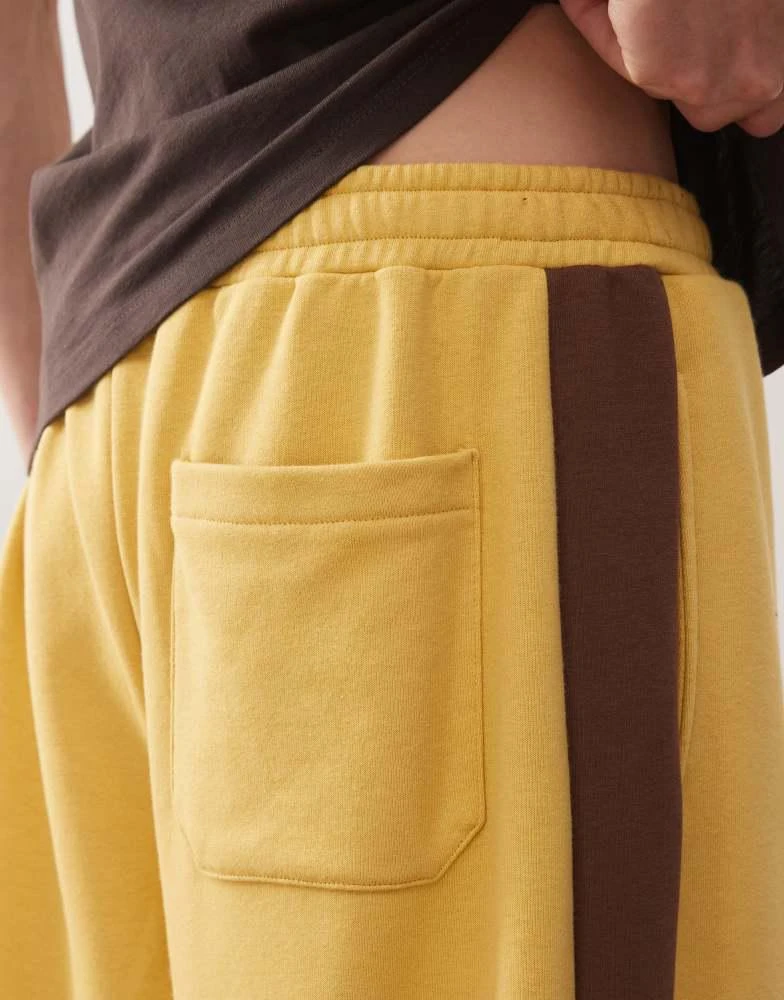 Reclaimed Vintage Reclaimed Vintage heavyweight wide leg jogger in mustard with brown side stripe 3