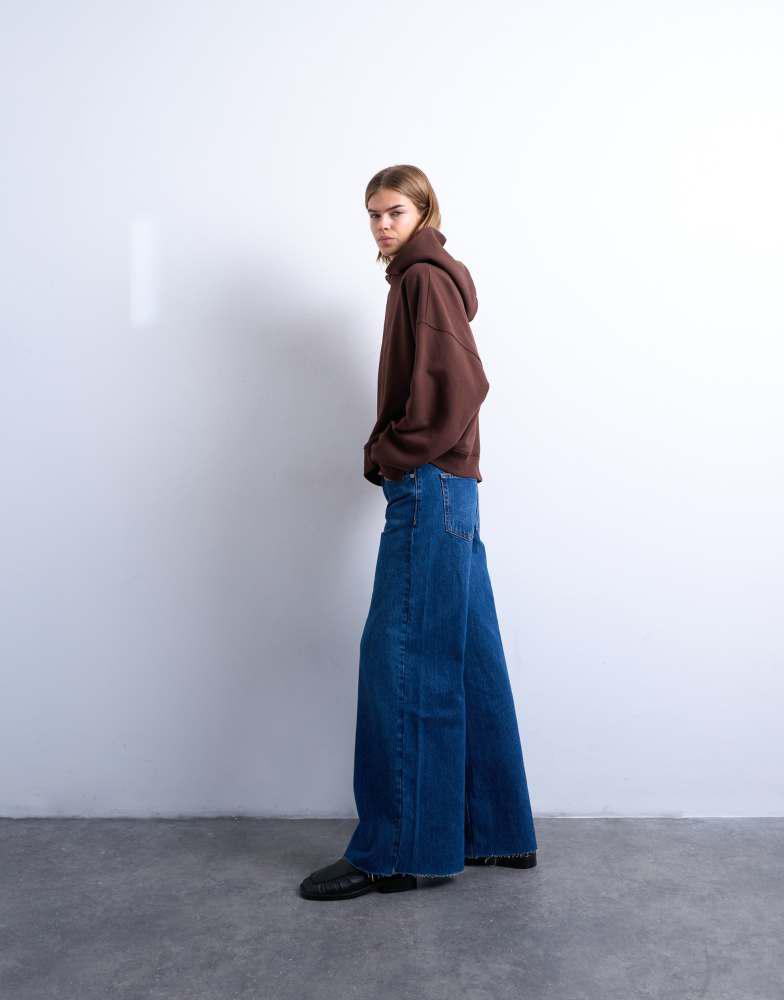 Topshop Topshop Horizon mid rise wide leg jean with raw hem in rich blue