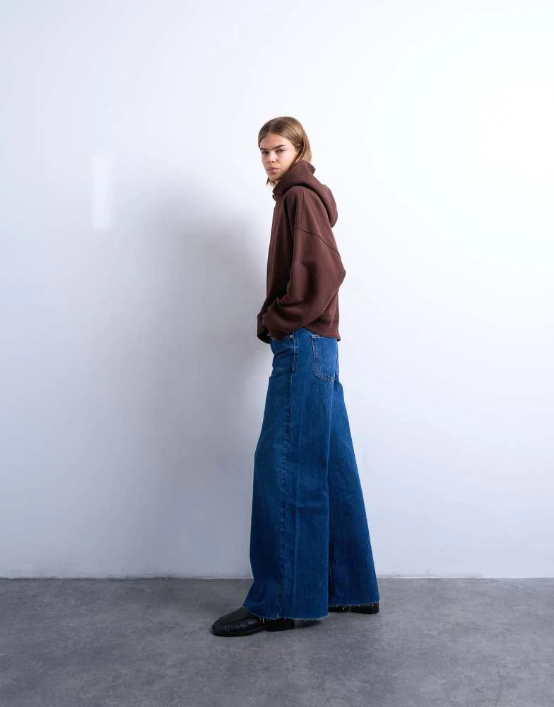 Topshop Topshop Horizon mid rise wide leg jean with raw hem in rich blue 1