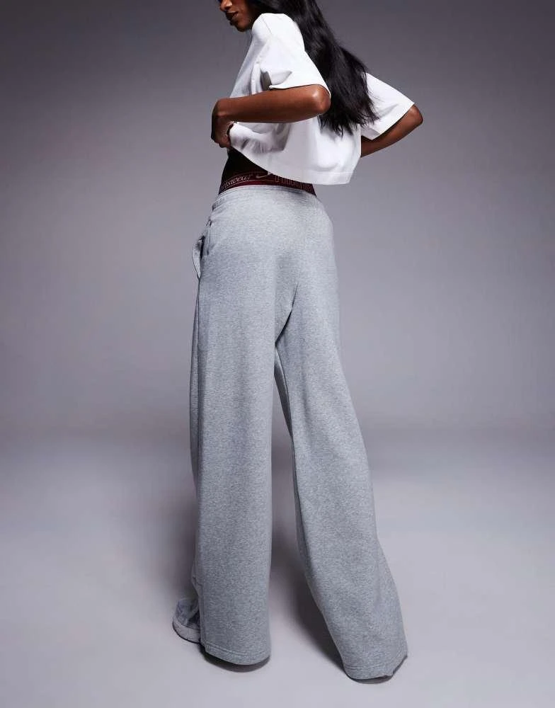 NIKE Nike Phoenix Fleece Gym Life Swoosh wide leg joggers with boxer detail in grey and burgundy 3