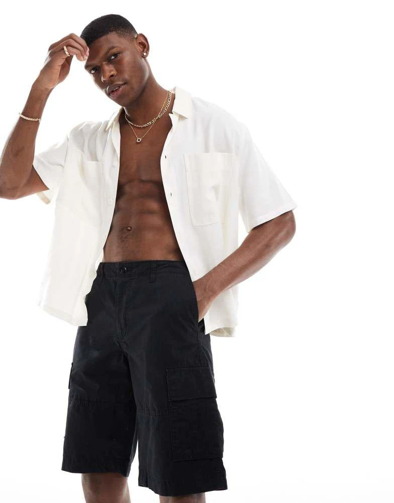 Shop Jack Jones loose fit cargo short in black on Sale at